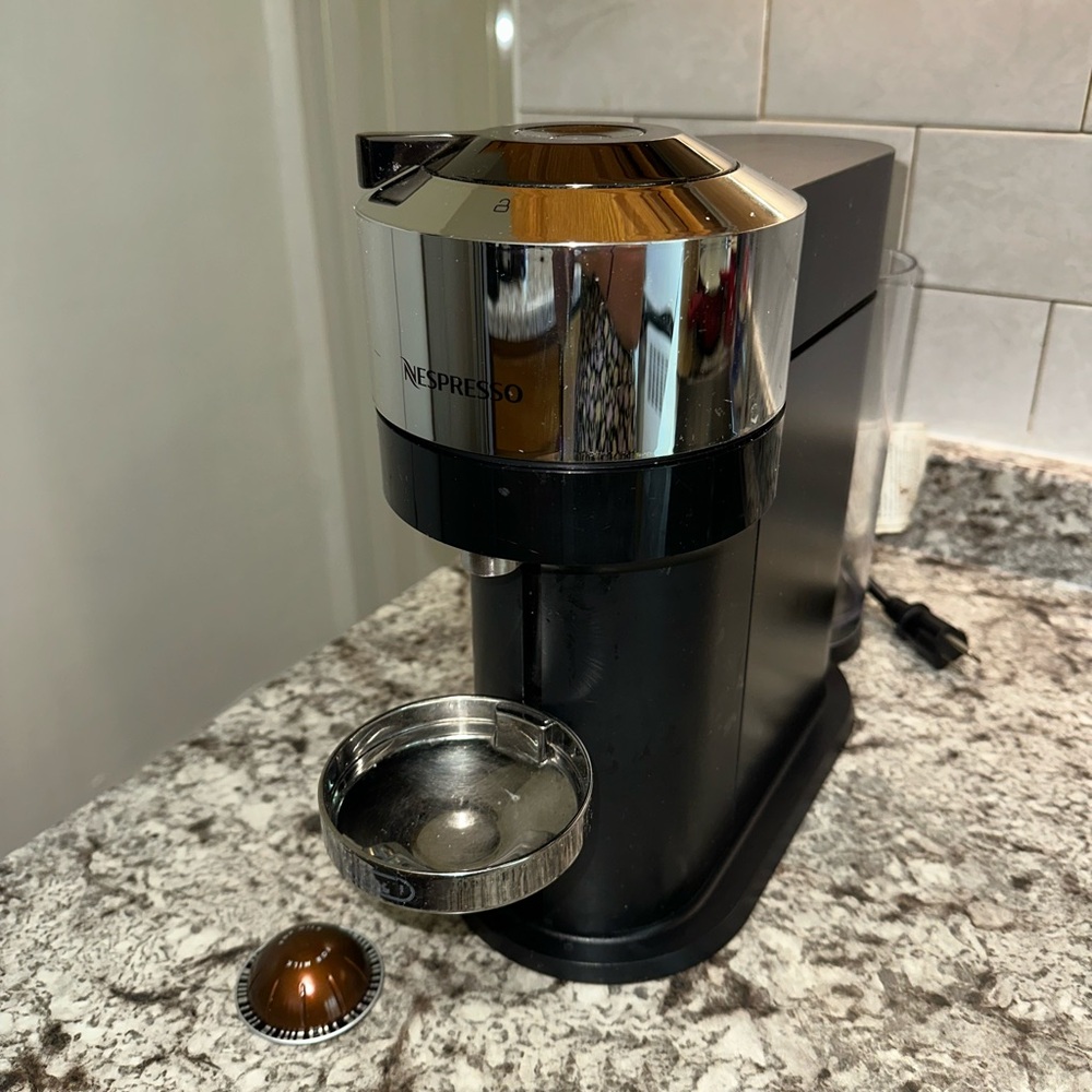 Nespresso Black and Chrome Coffee Maker
